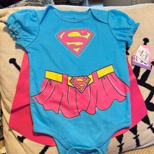 NWT Supergirl Baby baby romper, removable cape.  6-9 months - Blue and Pink